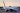 A large airplane parked on a runway after an emergency landing at an airport