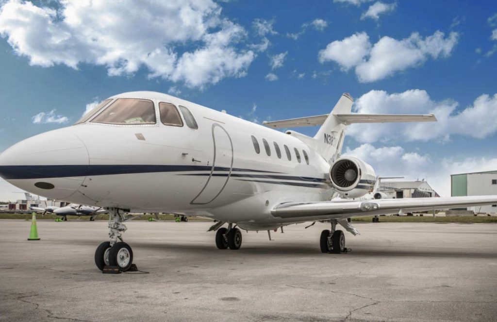 A luxurious jet parked at an airport, waiting for its owner to take off