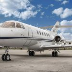 A luxurious jet parked at an airport, waiting for its owner to take off
