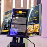 A large Samsung smartphone with three screens on display