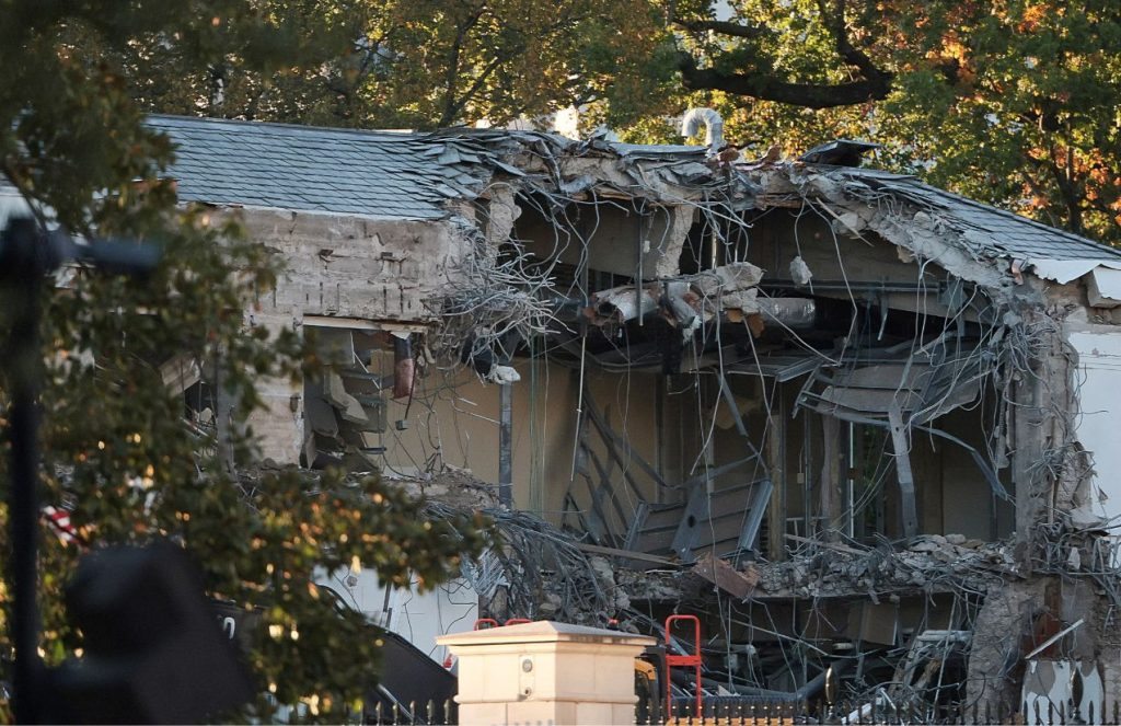 The east side of the White House almost completely demolished by a heavy construction machine