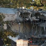 The east side of the White House almost completely demolished by a heavy construction machine