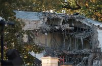The east side of the White House almost completely demolished by a heavy construction machine