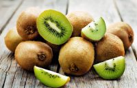 The power of Kiwi: A new hope to combat chronic constipation Several kiwis piled up, with only the ones on top cut in half