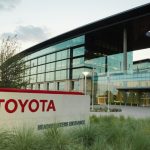 Toyota offices with large glass windows and the company’s name in bold red letters