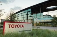 Toyota offices with large glass windows and the company’s name in bold red letters