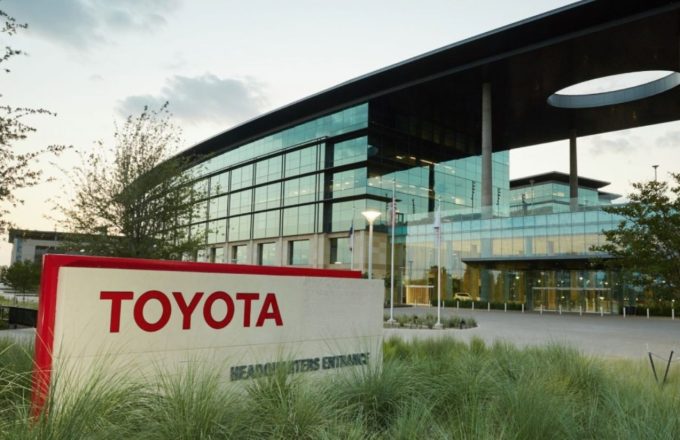 Toyota offices with large glass windows and the company’s name in bold red letters