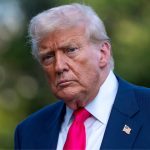 Donald Trump staring intently with a stern expression