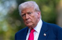 Donald Trump staring intently with a stern expression