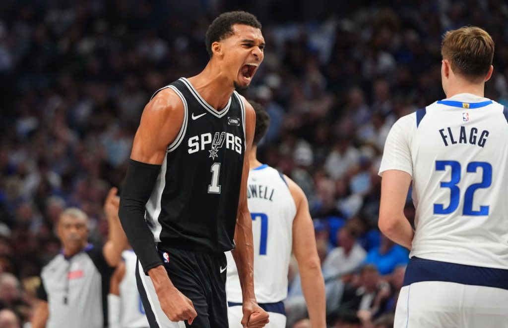 The great French player celebrating euphorically after scoring a basket in front of Cooper Flagg