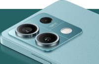 A Redmi Note 14 lying face down, showcasing its two powerful rear cameras