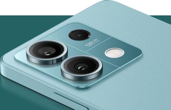 A Redmi Note 14 lying face down, showcasing its two powerful rear cameras