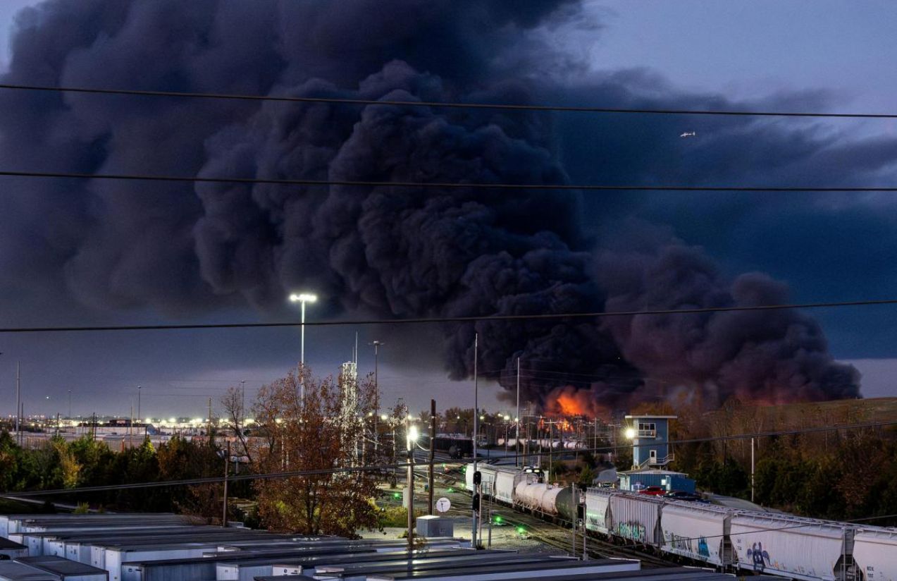 A massive black cloud rises after the crash and fire caused by the plane accident