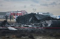 A completely charred airplane reduced to ashes after the intense crash