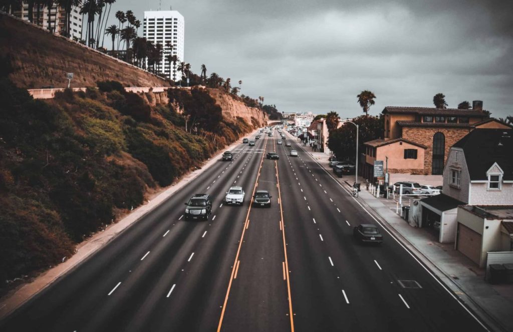 One of California’s most well-known highways with a few cars passing by on a rainy, overcast day