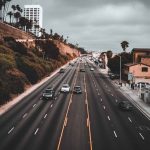 One of California’s most well-known highways with a few cars passing by on a rainy, overcast day