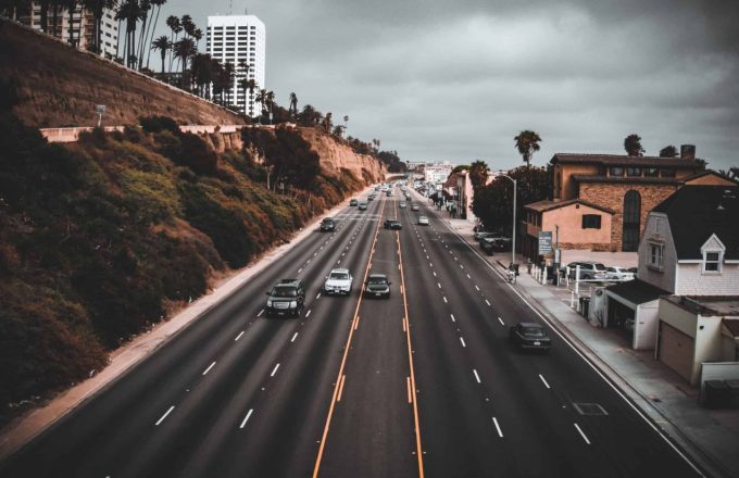 One of California’s most well-known highways with a few cars passing by on a rainy, overcast day
