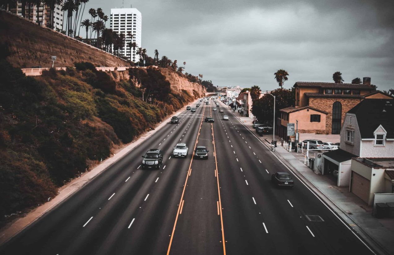One of California’s most well-known highways with a few cars passing by on a rainy, overcast day