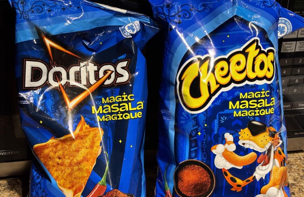 A bag of Cheetos and Doritos in blue packaging displayed on a shelf