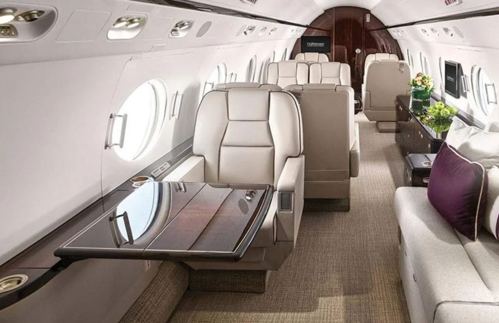 The interior of an elegant private jet with its luxurious upholstery