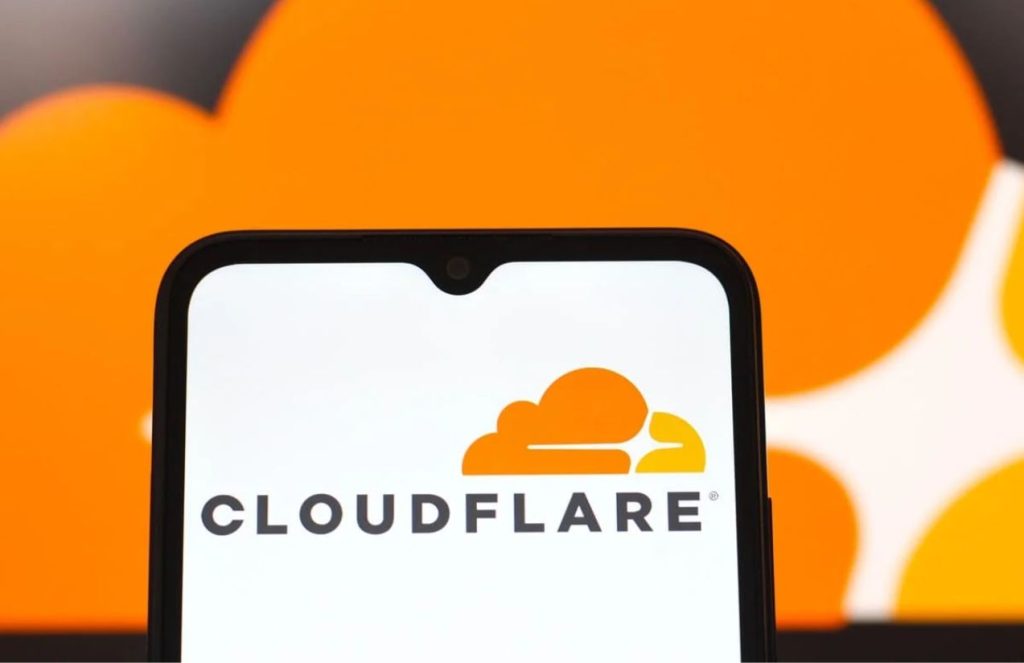 A cellphone opening the Cloudflare app with a white background and the striking orange logo