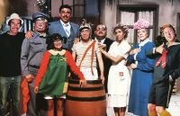 The iconic characters from El Chavo del 8 hugging and smiling for the camera