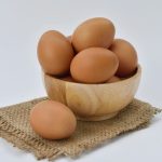 A small basket with multiple eggs