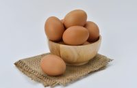 A small basket with multiple eggs