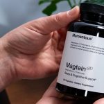 A person’s hand holding a bottle of magnesium