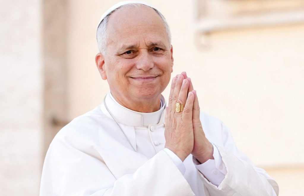 Pope Leo XIV receives 15 abuse victims from Belgium in a historic audience The Pope smiling with his hands together as he stands in front of his followers