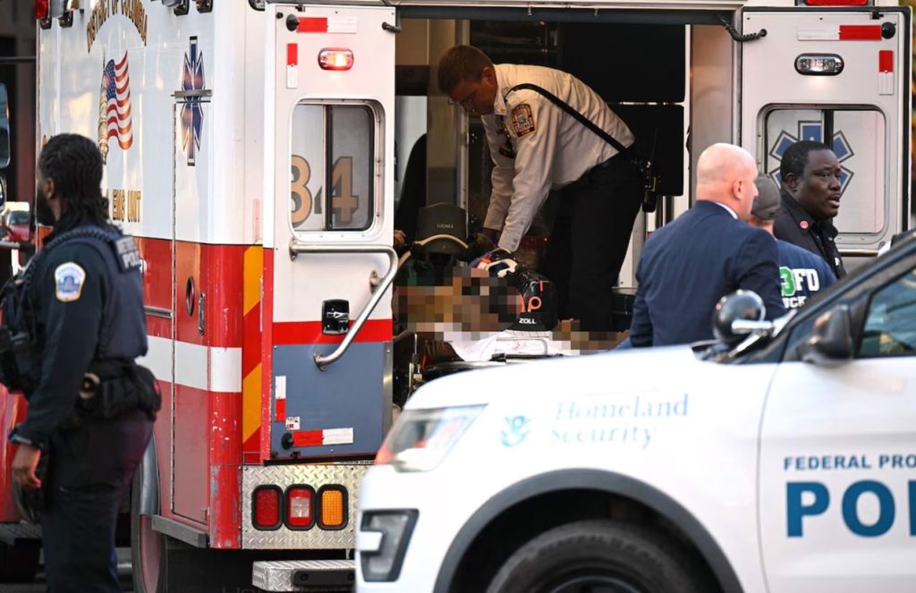 A wounded but censored person inside an ambulance
