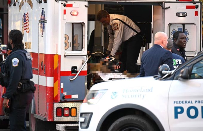 A wounded but censored person inside an ambulance