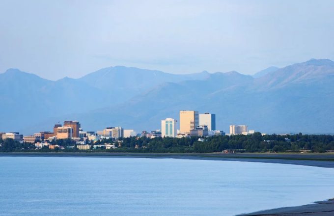 A city in Alaska seen from a boat in the middle of the sea