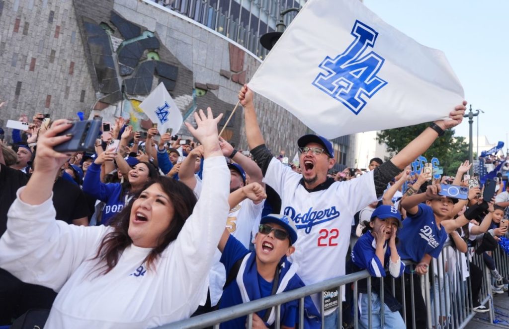 The Los Angeles Dodgers fill downtown L.A. in a world series champions parade Many Dodgers fans celebrating excitedly during the team’s parade after winning the baseball championship