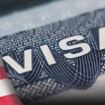 A visa document with the word VISA in red and blue colors.