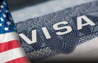 A visa document with the word VISA in red and blue colors.