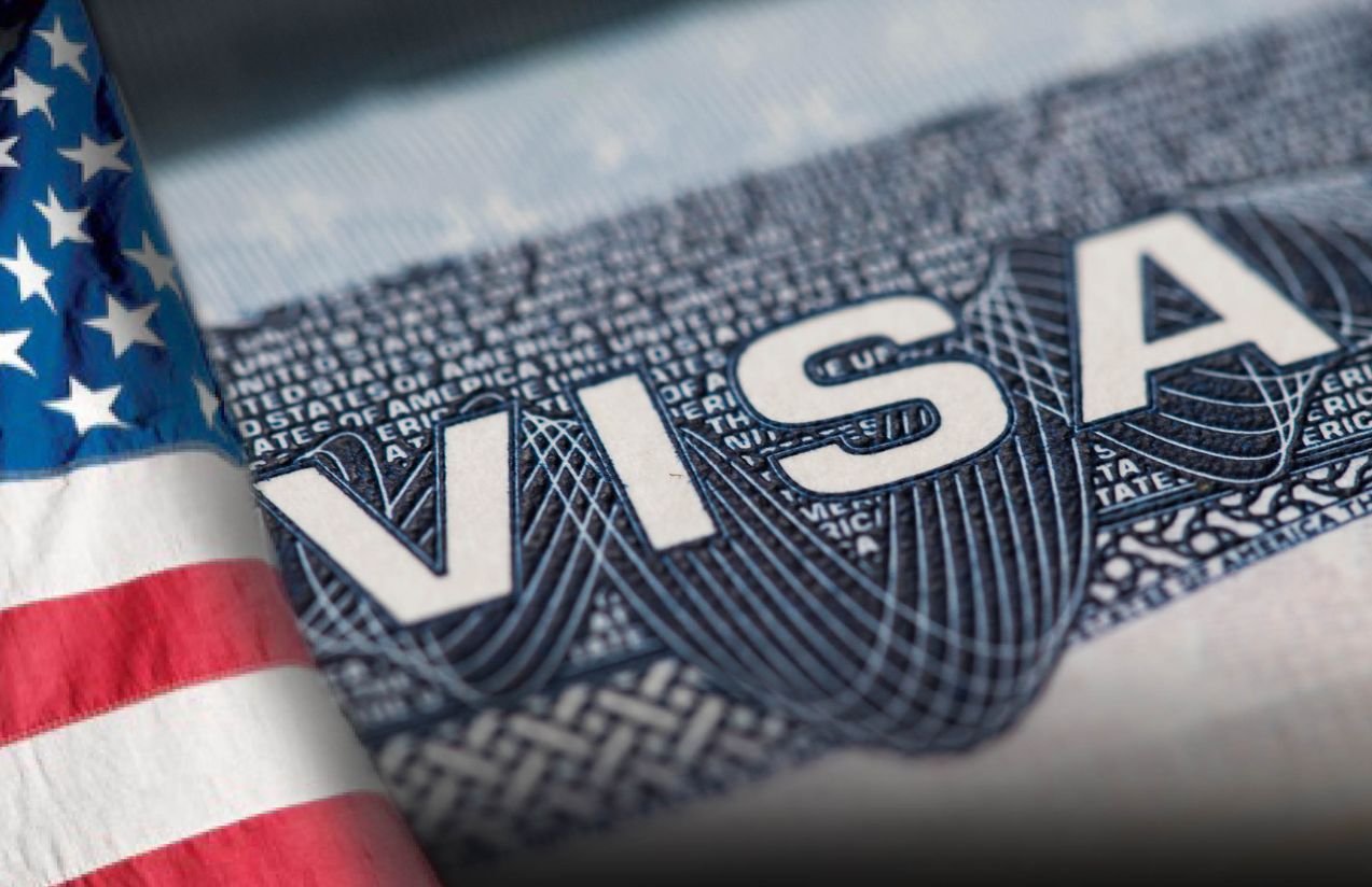 A visa document with the word VISA in red and blue colors.