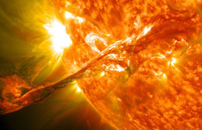 An artificial image of the Sun releasing a massive burst of energy heading toward the solar system