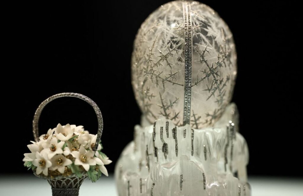 A beautiful white Fabergé egg with silver details