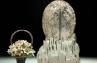 A beautiful white Fabergé egg with silver details