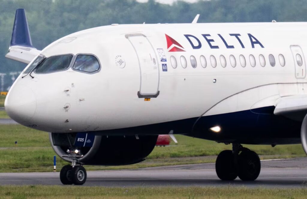 A Delta Air Lines aircraft parked at an airport while its passengers disembark