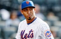 The former Mets player now looking toward the stands with a very serious expression