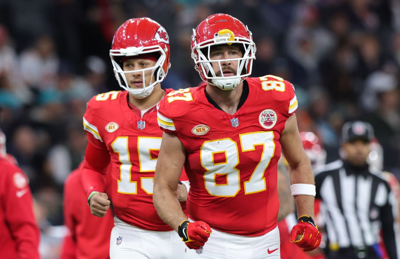 Patrick Mahomes and Travis Kelce wearing their uniforms in the middle of a game while running