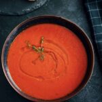 The famous American tomato soup served in a bowl on a table
