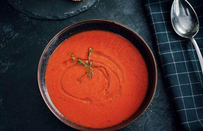 The famous American tomato soup served in a bowl on a table