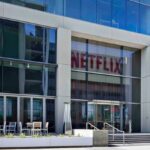 The Netflix offices, a white building with many windows and very large glass panels