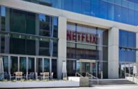 The Netflix offices, a white building with many windows and very large glass panels