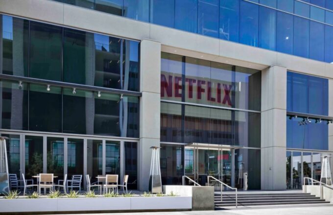 The Netflix offices, a white building with many windows and very large glass panels