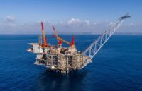 A gigantic Israeli offshore platform in the middle of the sea, with large cranes and pipelines