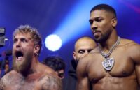 Jake and Anthony posing for the cameras before the fight, one with a serious attitude and the other with striking euphoria